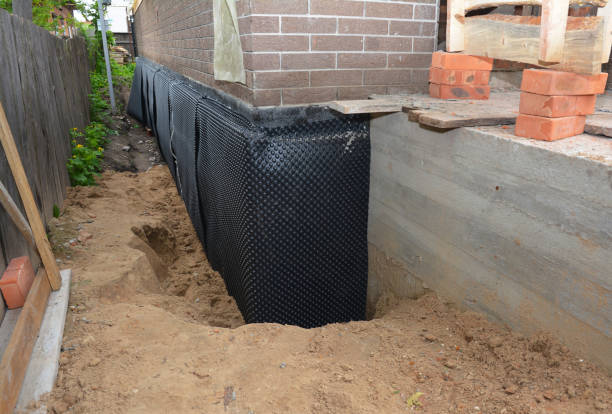 Happy homeowners after waterproofing job in Richmond Dale